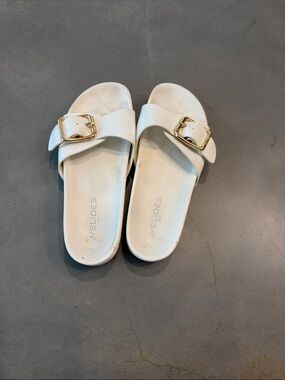 J/SLIDES White Slide Sandals with Gold Buckle Accent